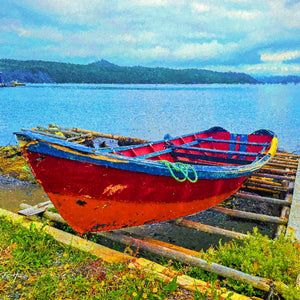 Hues of Humber Arm — a red wooden boat on a slipway at Humber Arm, Newfoundland, by Carol Fox Henrichs