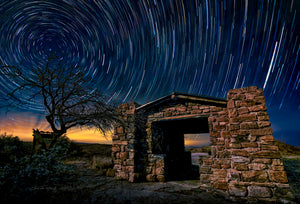 Fort Davis Light Show #1 — star trails over a stone shelter in Davis Mountains State Park, Texas, by Carol Fox Henrichs